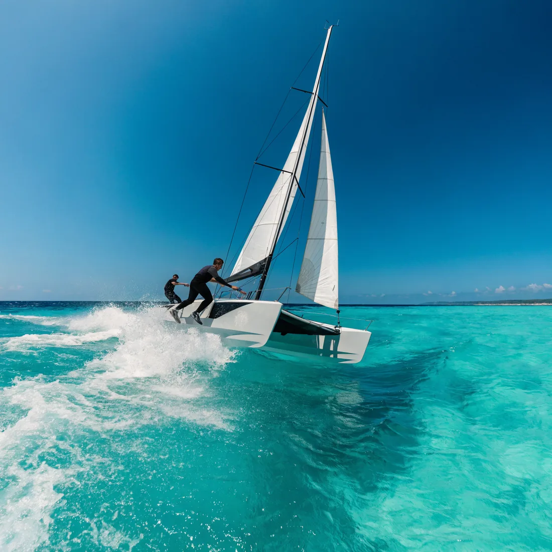 Sailing a catamaran on turquoise water